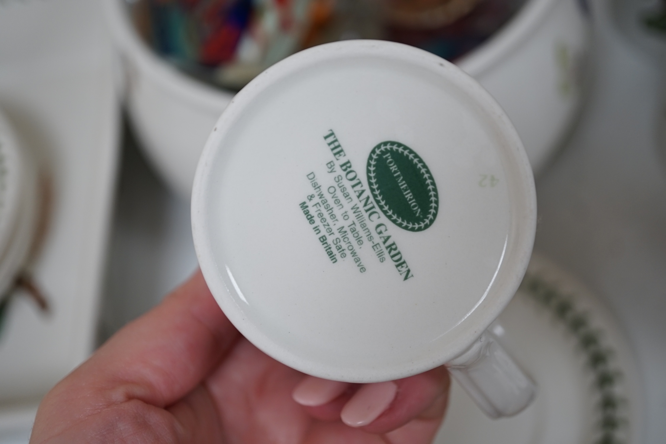 A large quantity of Portmeirion 'Botanic Gardens' tea, dinner and kitchen wares, together with cutlery and seven glass paperweights